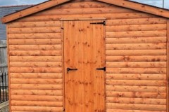 Log-Lap-Apex-Shed-with-single-door-treated-red-cedar-