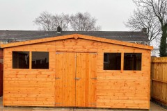Tongue-and-Groove-Apex-Shed-with-double-doors-and-standard-windows-treated-red-cedar-